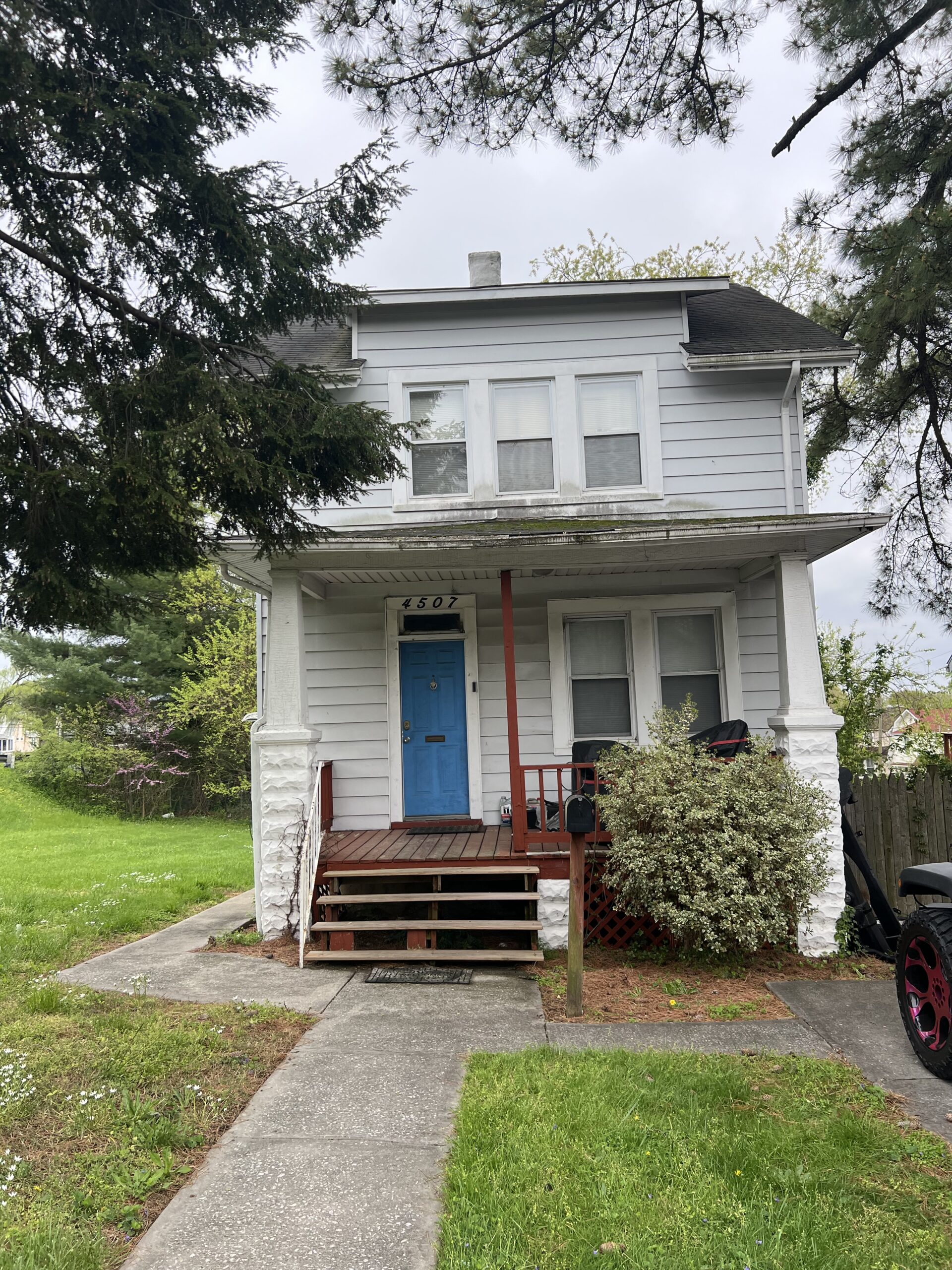 a house with a car parked in front of it