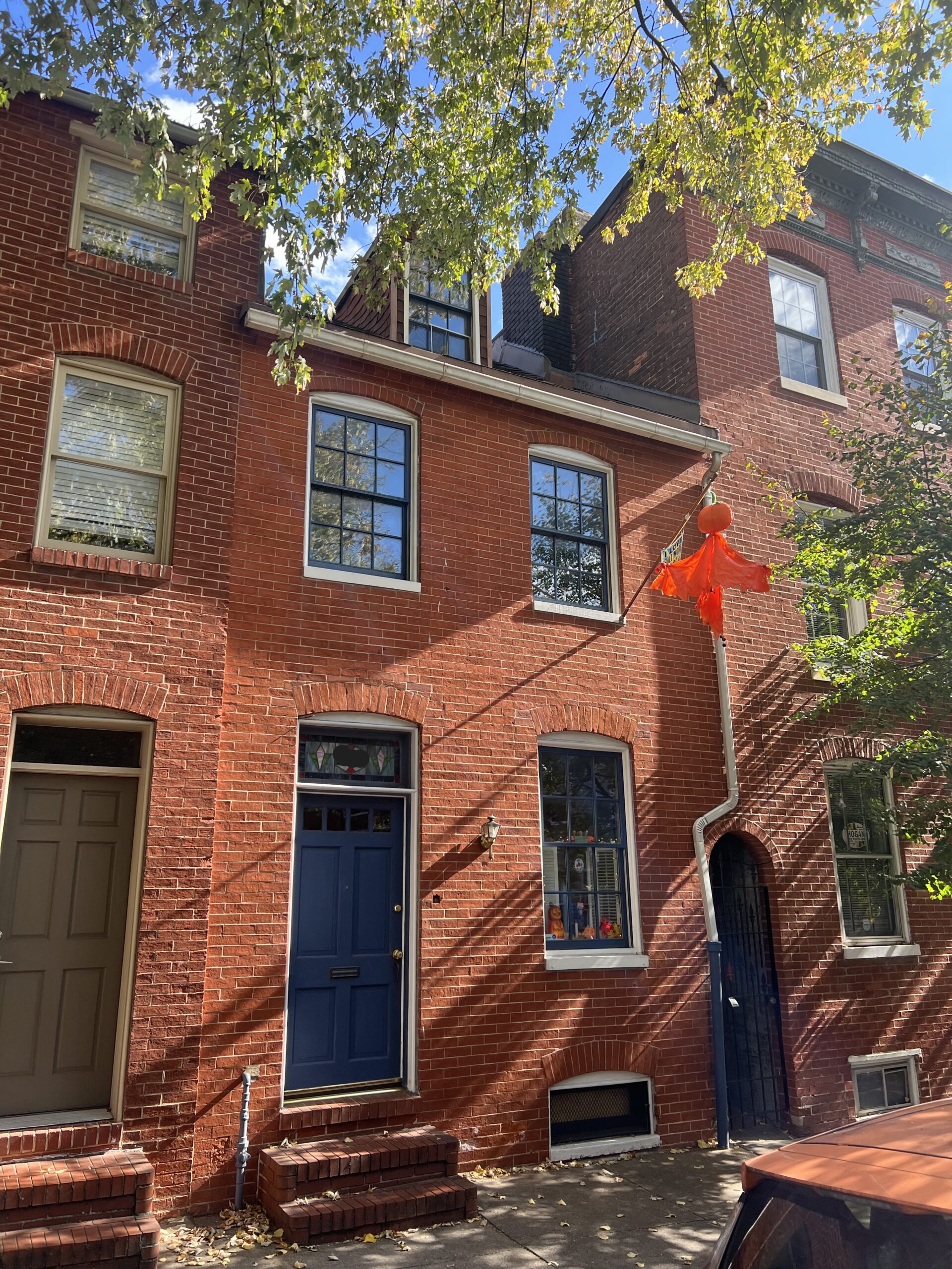 a red brick building with a blue door