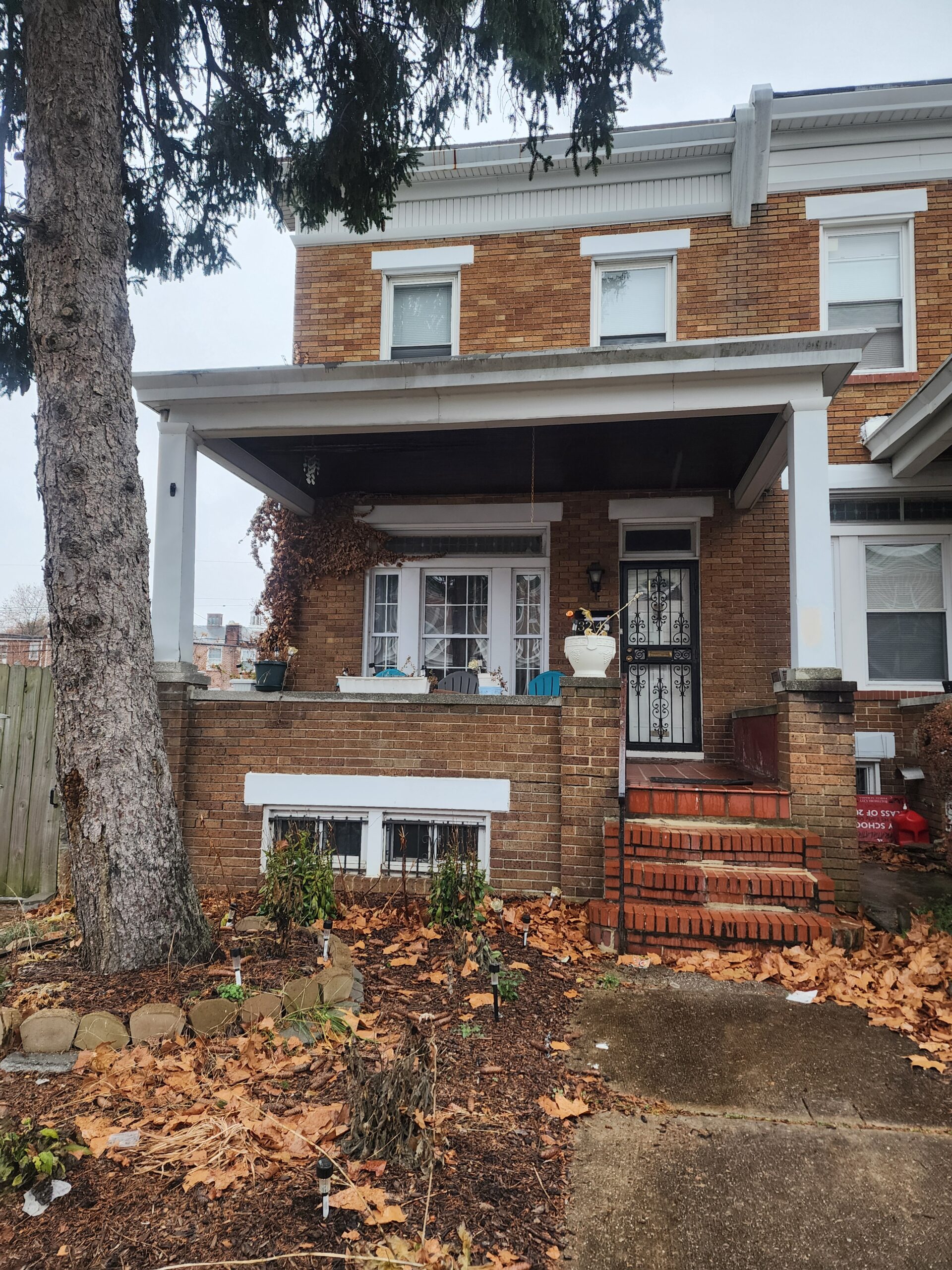 a house with a tree in front of it